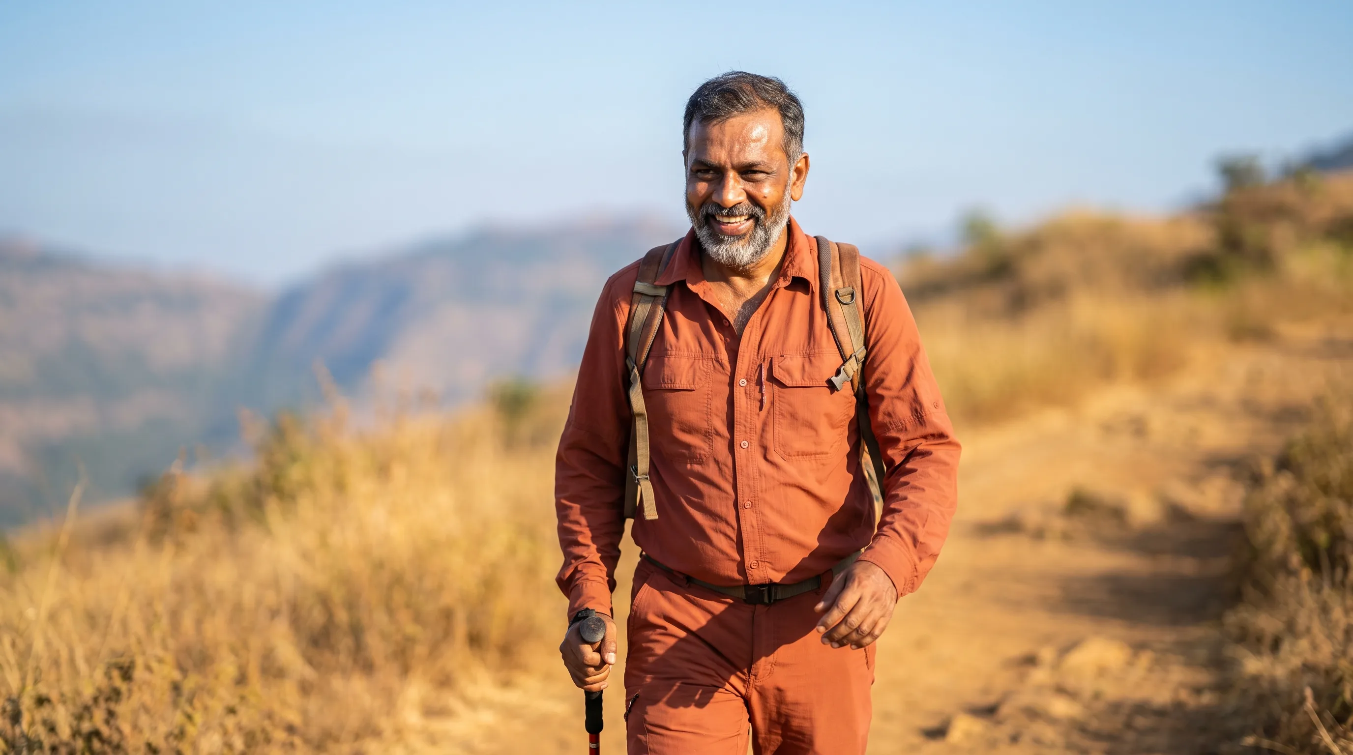 A man hiking a sunlit trail, energized and active