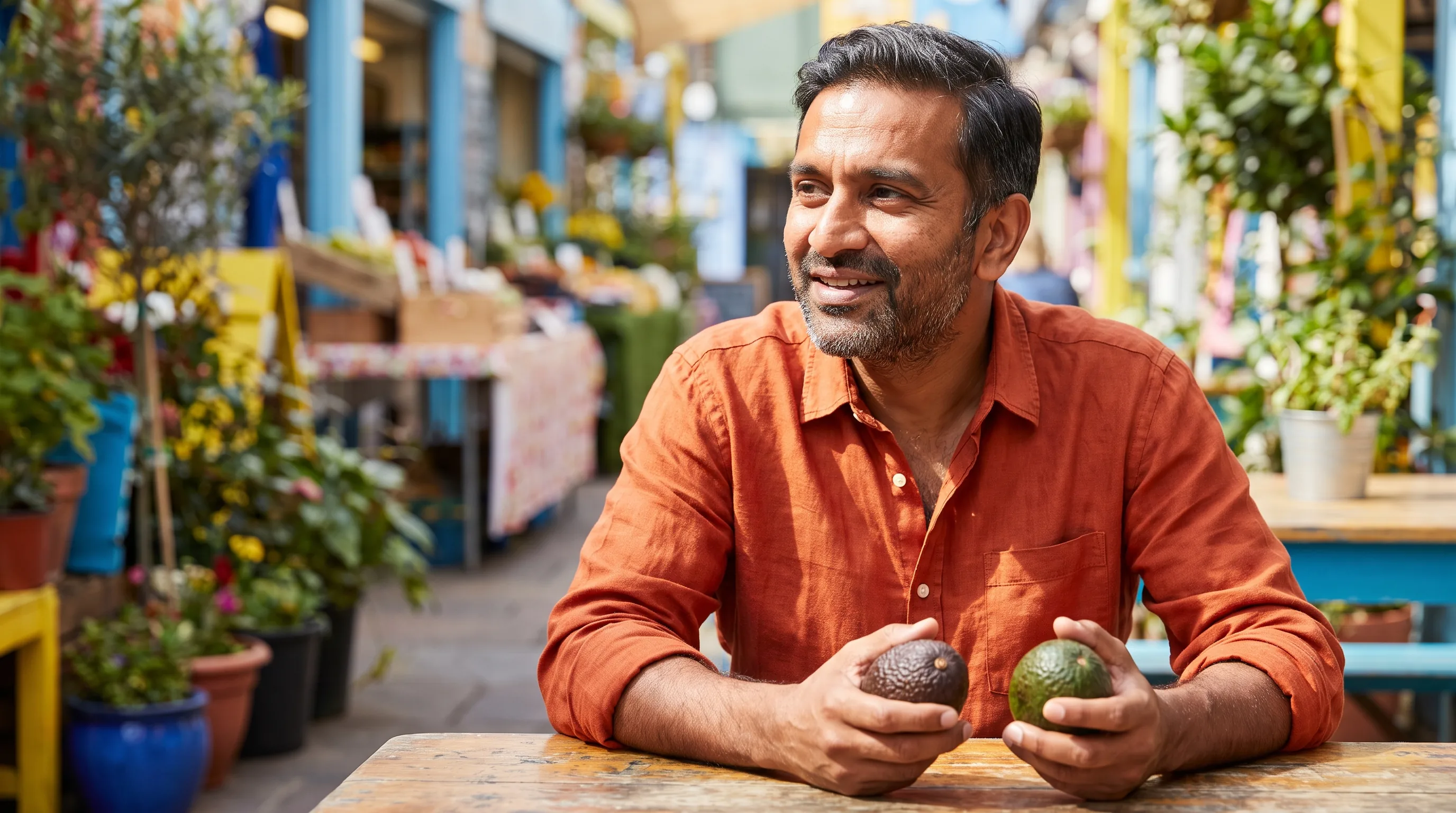 A warm, happy, colorful photo of a healthy adult in bright natural light, smiling and relaxed as they weigh their options